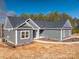 Gray house exterior with white trim, landscaping, and a curved walkway at 2572 Maiden-Salem Road Maiden Salem Rd # 4, Lincolnton, NC 28092