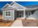 House front porch with gray siding, brown door and white trim at 2572 Maiden-Salem Road Maiden Salem Rd # 4, Lincolnton, NC 28092