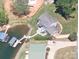 Aerial view of waterfront home with private dock and boat lift at 2579 Ranger Island Rd, Denver, NC 28037