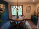 Charming dining room features a round wooden table and blue accent wall at 2579 Ranger Island Rd, Denver, NC 28037