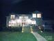 Back of house at night, showing deck and hot tub at 2579 Ranger Island Rd, Denver, NC 28037