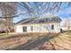 View of the backyard featuring a brick patio and mature trees at 2820 Rosemeade Dr, Monroe, NC 28110