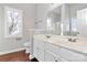 Bright bathroom with double vanity, framed mirror, and wood look flooring at 2820 Rosemeade Dr, Monroe, NC 28110