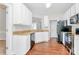 Well-lit kitchen with white cabinetry, granite countertops, and stainless steel appliances at 2820 Rosemeade Dr, Monroe, NC 28110