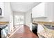 Bright kitchen area featuring granite countertops, stainless sink, and patio doors at 2820 Rosemeade Dr, Monroe, NC 28110