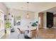 Bright dining area with round marble table and modern light fixture at 2943 Tallgrass Blf, Rock Hill, SC 29732