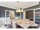 Elegant dining room with a light wood table and chandelier at 2943 Tallgrass Blf, Rock Hill, SC 29732