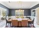 Bright dining room with a large table and modern chandelier at 2943 Tallgrass Blf, Rock Hill, SC 29732