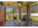 Relaxing screened porch with wicker furniture and ceiling fan at 2943 Tallgrass Blf, Rock Hill, SC 29732