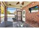 Screened porch with tiled floor, wicker furniture, and TV at 2943 Tallgrass Blf, Rock Hill, SC 29732