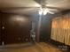 Bedroom with dark wood paneling and ceiling fan at 3326 Winterfield Pl, Charlotte, NC 28205