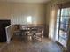 Dining area with wood table and access to deck at 3326 Winterfield Pl, Charlotte, NC 28205