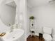 Small bathroom with pedestal sink and toilet at 3551 Spencer St, Charlotte, NC 28205