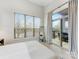 Bright bedroom with sliding glass door leading to a private balcony at 3551 Spencer St, Charlotte, NC 28205