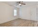 Bright bedroom with wood-look floors and neutral walls at 3711 Indian Ct, Lenoir, NC 28601