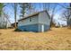 Rear view of house, showing gray siding and blue foundation at 3711 Indian Ct, Lenoir, NC 28601