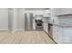 Bright kitchen featuring stainless steel appliances and light wood flooring at 3711 Indian Ct, Lenoir, NC 28601