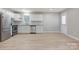 Renovated kitchen with white cabinets, granite countertops and stainless steel appliances at 3711 Indian Ct, Lenoir, NC 28601