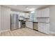 Modern kitchen with stainless steel appliances and white cabinets at 3711 Indian Ct, Lenoir, NC 28601