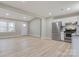 Open living room and kitchen area with light flooring and neutral walls at 3711 Indian Ct, Lenoir, NC 28601