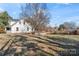 Spacious backyard with large grassy area and mature trees at 410 7Th St, Spencer, NC 28159