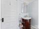 Bathroom with pedestal sink and built-in medicine cabinet at 410 7Th St, Spencer, NC 28159