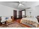 Bright bedroom with hardwood floors, ceiling fan and ample space at 410 7Th St, Spencer, NC 28159