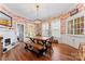 Bright dining room featuring a wooden table and toile wallpaper at 410 7Th St, Spencer, NC 28159