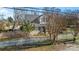 House with white siding, gray roof, and a picket fence at 410 7Th St, Spencer, NC 28159