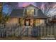 House with teal front door and string lights at dusk at 410 7Th St, Spencer, NC 28159