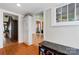 View of hallway with hardwood floors, built-in storage, and access to other rooms at 410 7Th St, Spencer, NC 28159