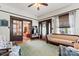 Living room with hardwood floors, decorative fireplace, and vintage furniture at 410 7Th St, Spencer, NC 28159