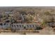 Aerial view of townhouses and houses in a wooded neighborhood at 4126 Walker Rd, Charlotte, NC 28211