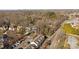 Aerial view showing a neighborhood with houses and tree-lined streets at 4126 Walker Rd, Charlotte, NC 28211