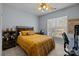 Bright bedroom with a comfortable bed and workspace at 4126 Walker Rd, Charlotte, NC 28211