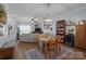 Bright dining area with wood table and chairs, hardwood floors at 4126 Walker Rd, Charlotte, NC 28211