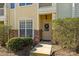 Neat and welcoming entryway with a neutral door and landscaping at 4126 Walker Rd, Charlotte, NC 28211