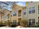 Inviting townhome exterior boasts charming architectural details and landscaping at 4126 Walker Rd, Charlotte, NC 28211