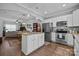 Spacious kitchen with island, stainless steel appliances, and granite countertops at 4126 Walker Rd, Charlotte, NC 28211