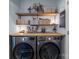 Laundry room with LG washer and dryer, shelving at 4126 Walker Rd, Charlotte, NC 28211