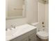 Clean bathroom with gray vanity, white sink and bathtub at 4762 Old Lantern Way, Charlotte, NC 28212