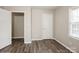 Bedroom with wood-look floors, closet, and window at 4762 Old Lantern Way, Charlotte, NC 28212