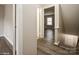 View of a hallway with wood-look flooring and doors leading to other rooms at 4762 Old Lantern Way, Charlotte, NC 28212