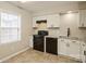 Updated kitchen with white cabinets and black appliances at 4762 Old Lantern Way, Charlotte, NC 28212