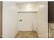 Small laundry area with shelving and hookups at 4762 Old Lantern Way, Charlotte, NC 28212