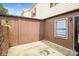 Private patio area with brick wall and wood fencing at 4762 Old Lantern Way, Charlotte, NC 28212