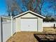 Detached garage with white door and light beige siding at 503 E 10Th St, Kannapolis, NC 28083