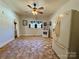 Kitchen with white cabinets, tiled floor and corner sink at 503 E 10Th St, Kannapolis, NC 28083