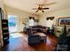 Living room with hardwood floors, sectional sofa, and armchair at 503 E 10Th St, Kannapolis, NC 28083