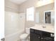 Bathroom with tub, shower, and dark vanity at 5030 Monacan Way, Indian Land, SC 29707